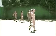 Bunch of guys playing soccer naked to distinguish themselves from the other team