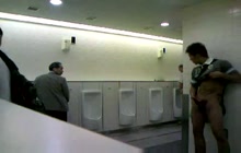 Asian dude jerking off in public restroom